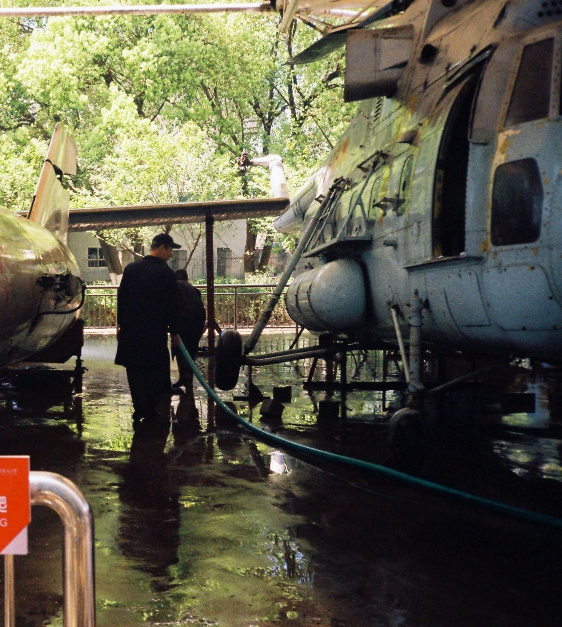 Two aircraft and a helicopter on display